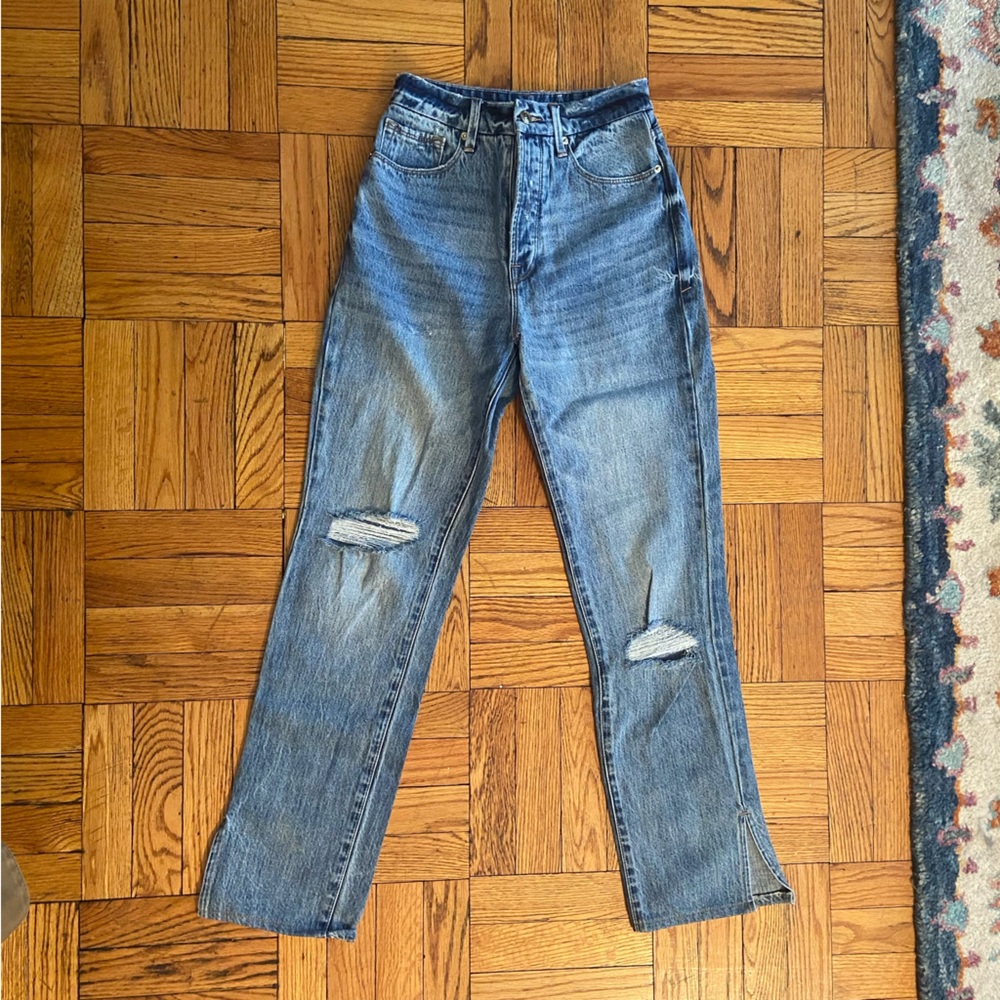 Good American blue jeans with distressed details